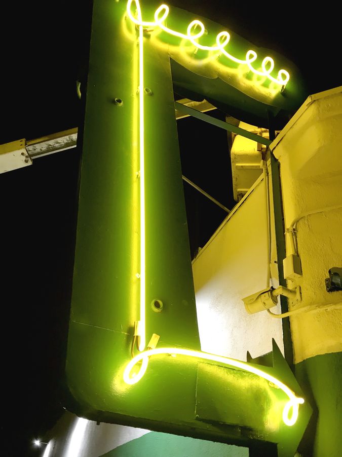 illuminated neon arrow sign