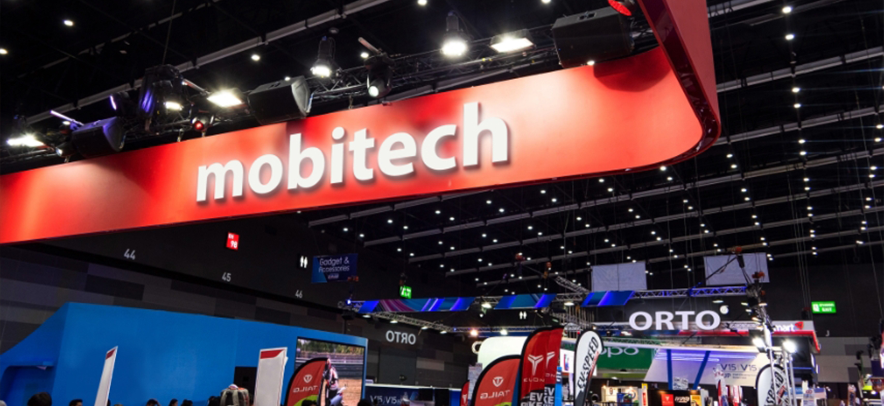 Mobitech corporate event signage on a red background with white 3d letters for branding