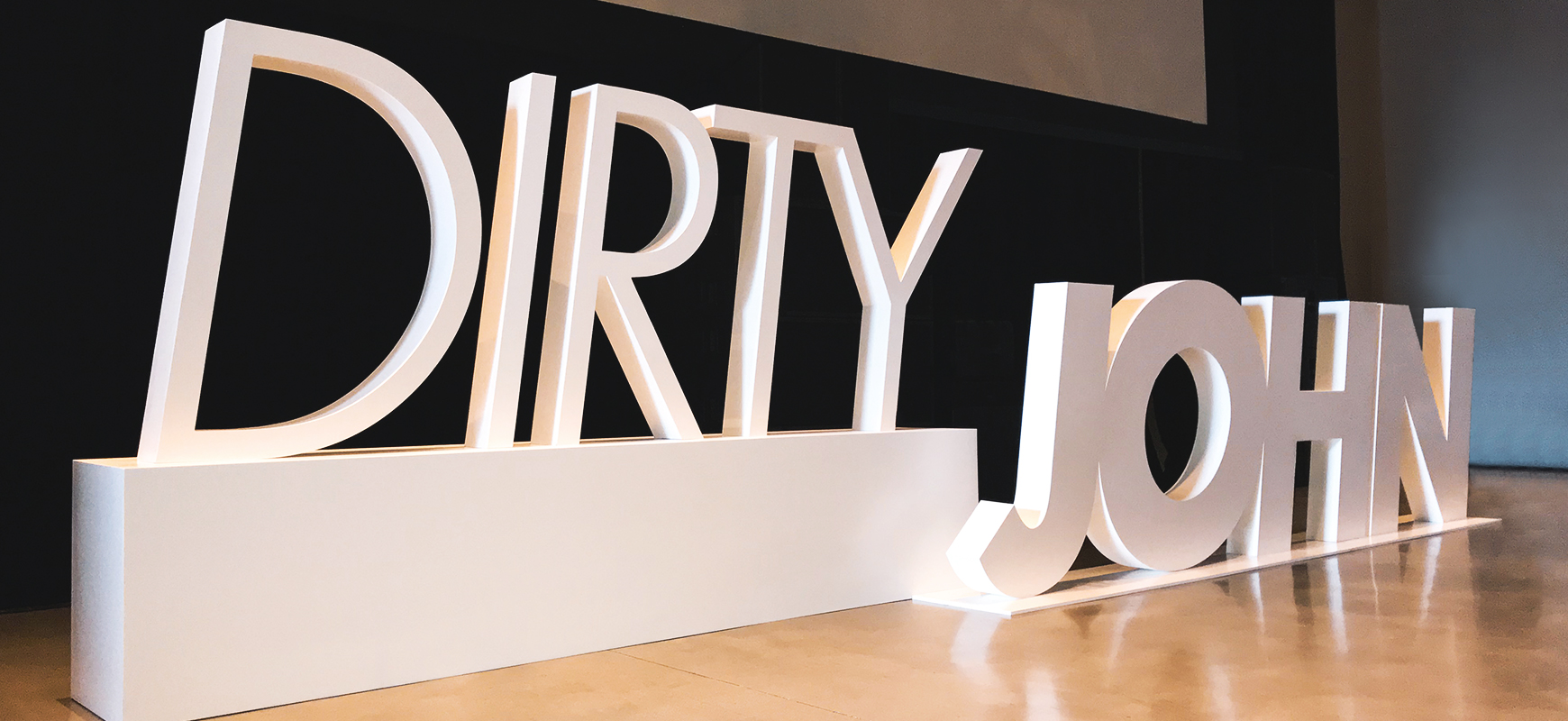 white corporate event signage with large 3d letters made of PVC
