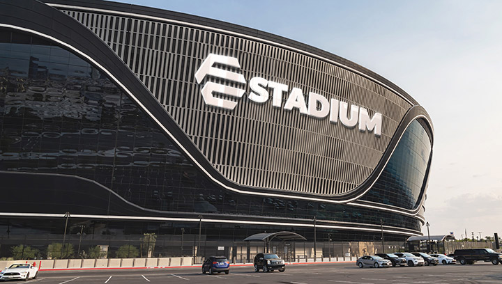 large custom arena signage in white displaying the brand name and logo