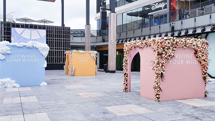 Summer Fridays corporate event signage with custom flower-designed displays made of PVC