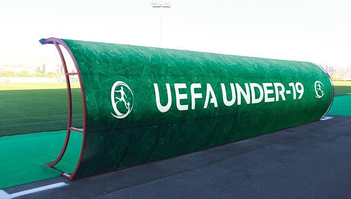 UEFA soccer field signage displaying the championship name and logo made of vinyl