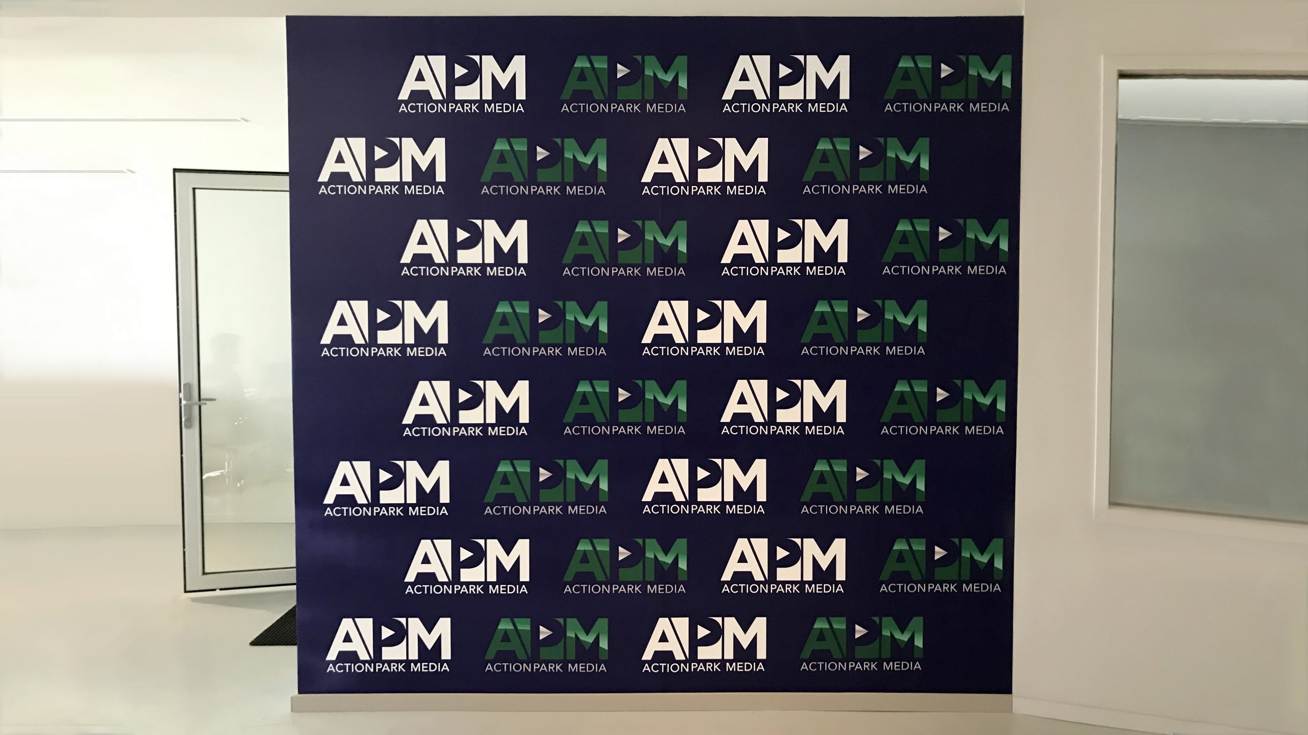 Action Park Media custom interior wall sign in the step and repeat style made of opaque vinyl