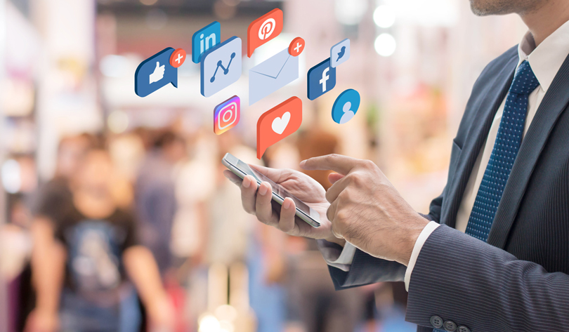 trade show attendee checking social media accounts trade show attendee checking his social media accounts