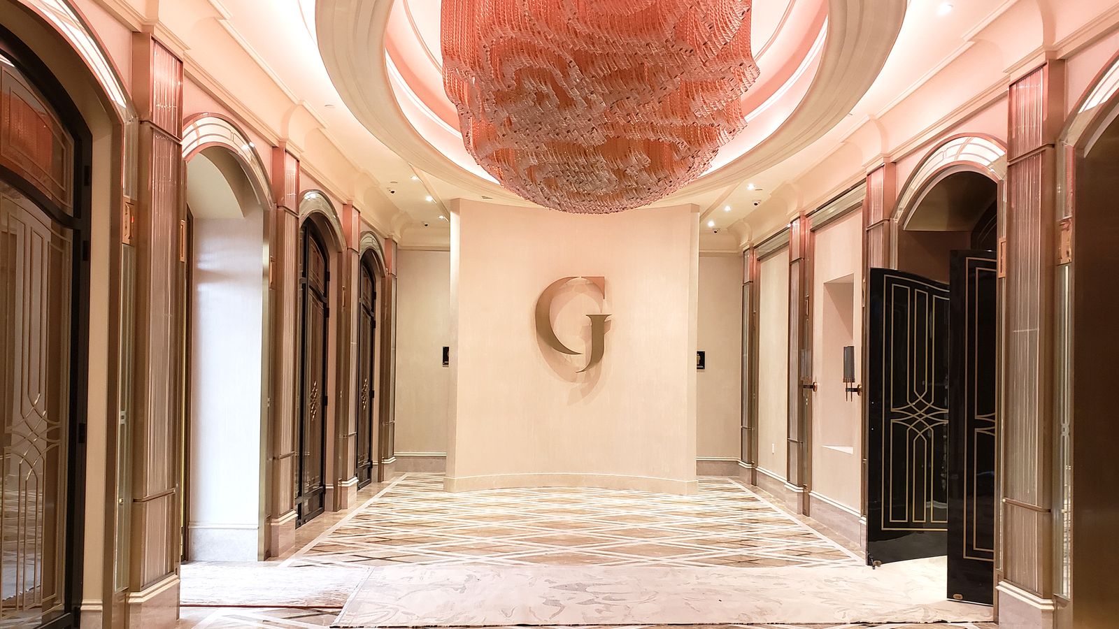 Grand Venue interior logo signage displaying the letter G made of aluminum for branding