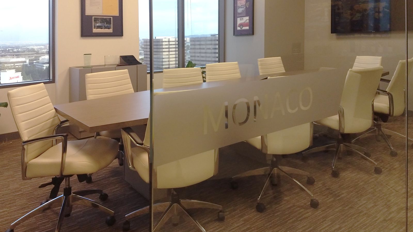 custom indoor sign with the word Monaco on the window made of frosted vinyl for privacy