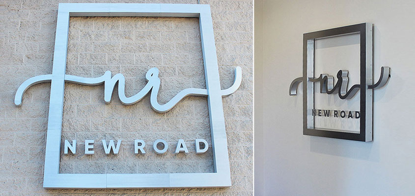 Example from New Road's branding showing how to make a business sign for outdoor and indoor