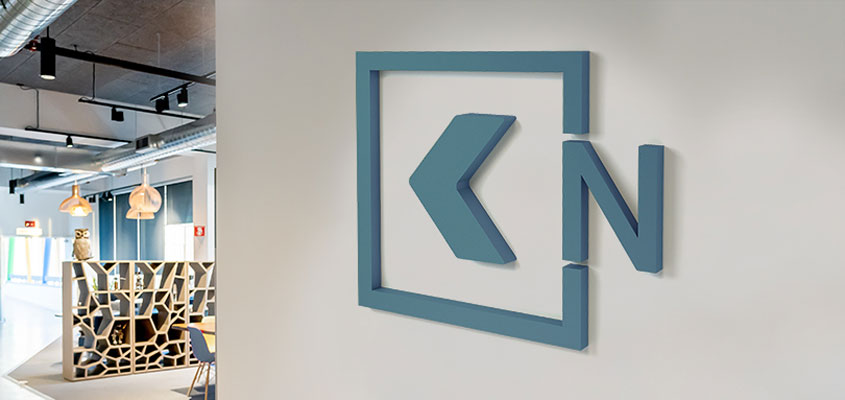 Corporate interior design example showing how to design a directional business sign