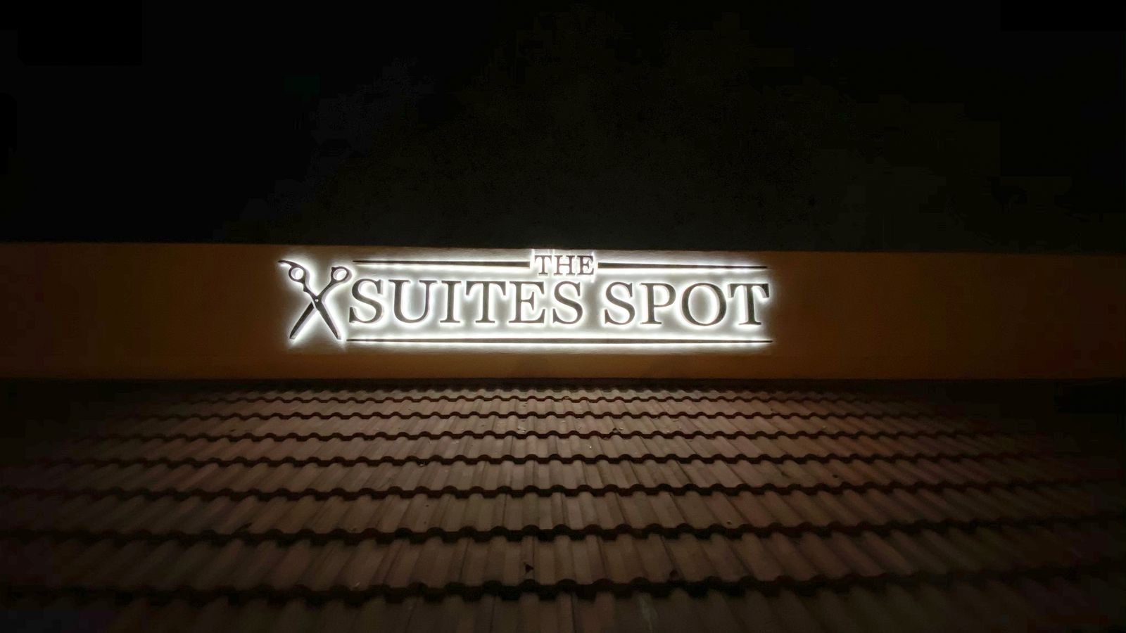 Suites Spot backlit sign