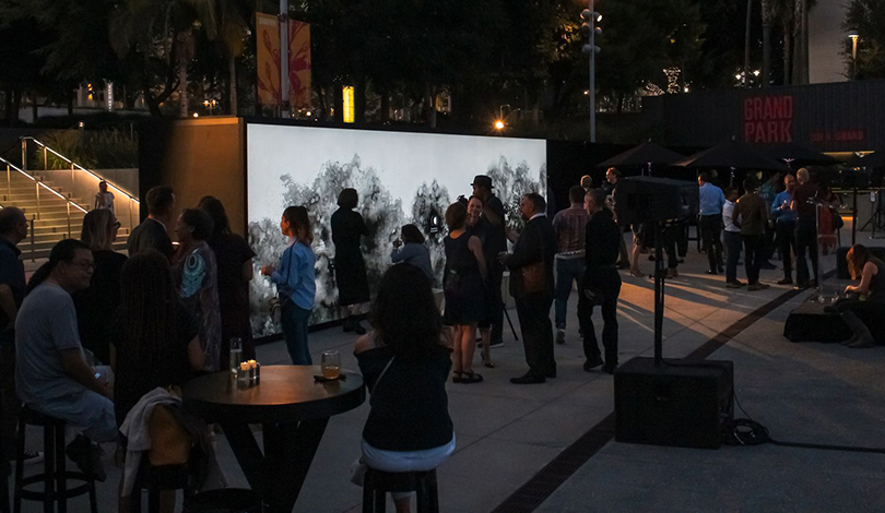 crowd enjoying the event at Annenberg illuminated stand-Frontsigns