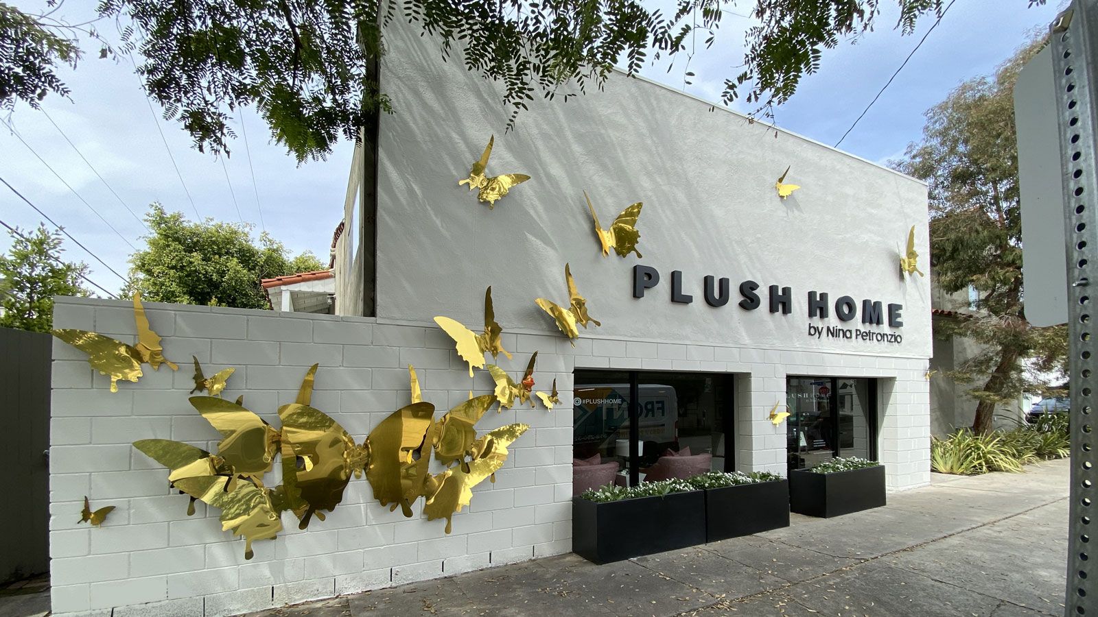 plush home storefront sign