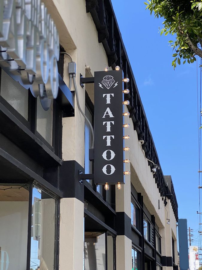 Wall-blade light box sign for a tattoo store | Front Signs Wall-blade light box sign for a tattoo store | Front Signs