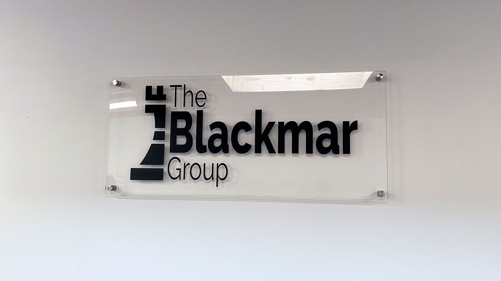 the black group acrylic sign