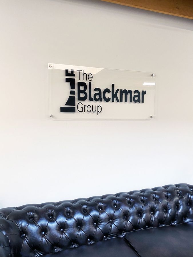 the black group office sign