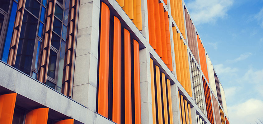 Bank building exterior design idea with colorful aluminum bars