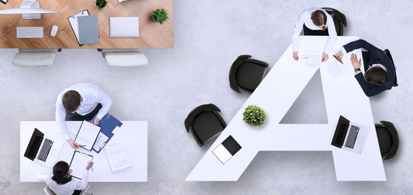 Letter-shaped desk design solution to make creative atmosphere at workspace 