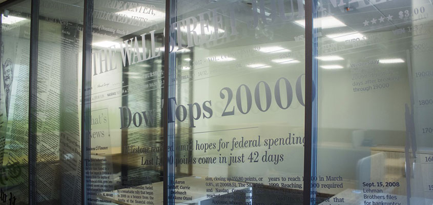 Office window vinyl lettering design idea with numbers and company achievements