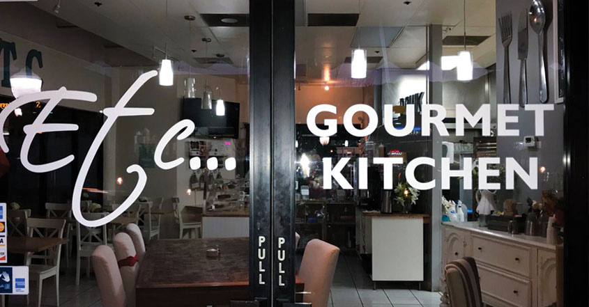 Gourmet Kitchen window decals applied for restaurant exterior design