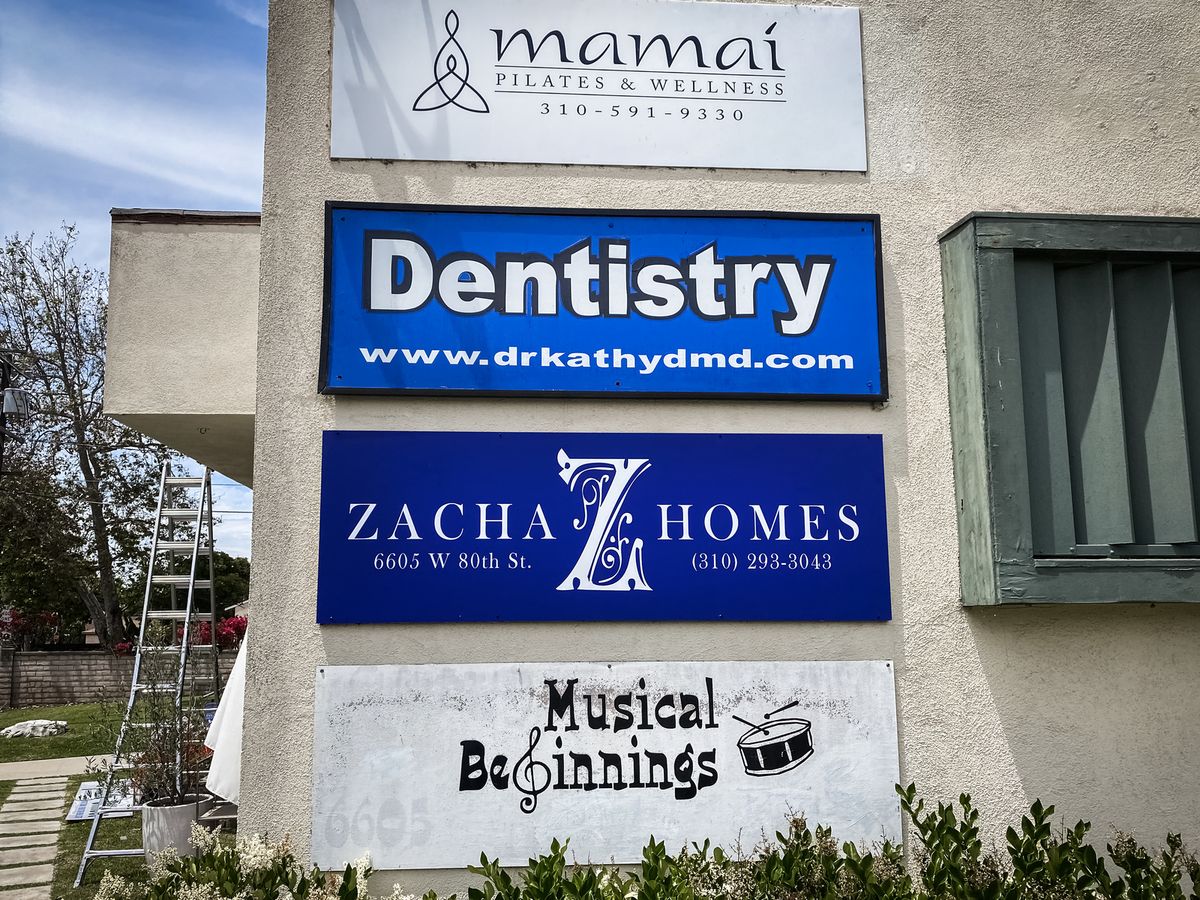 Zacha Homes plywood sign