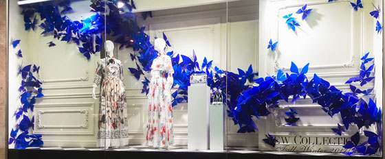 artful storefront display with acrylic blue butterflies