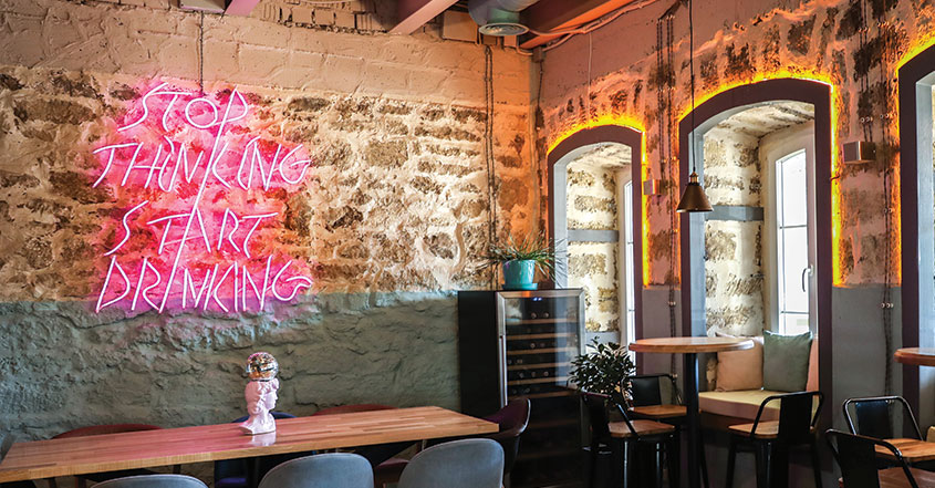 Restaurant bar design with neon sign quote