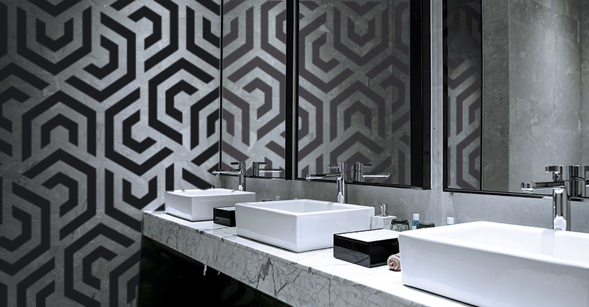 Restaurant bathroom design with black and white geometric wallpaper