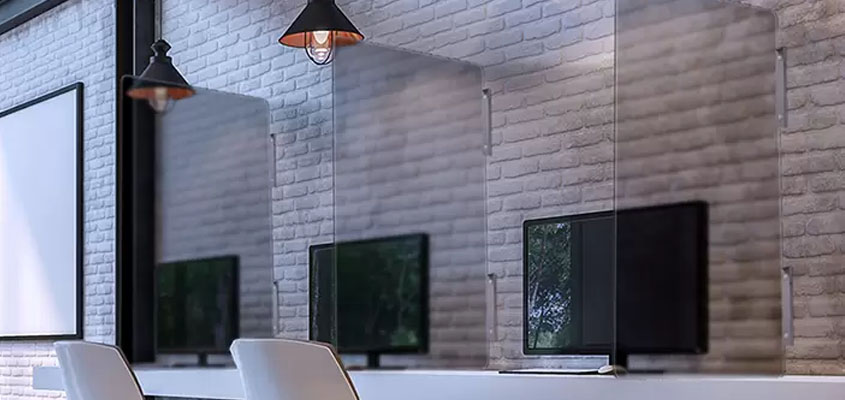 Office space sneeze guards installed for maintaining social distance