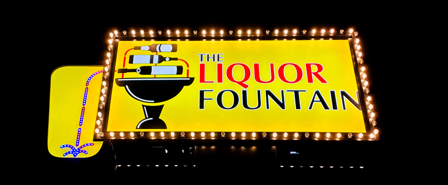 The Liquor Fountain marquee sign with a pole made of aluminum and acrylic for branding