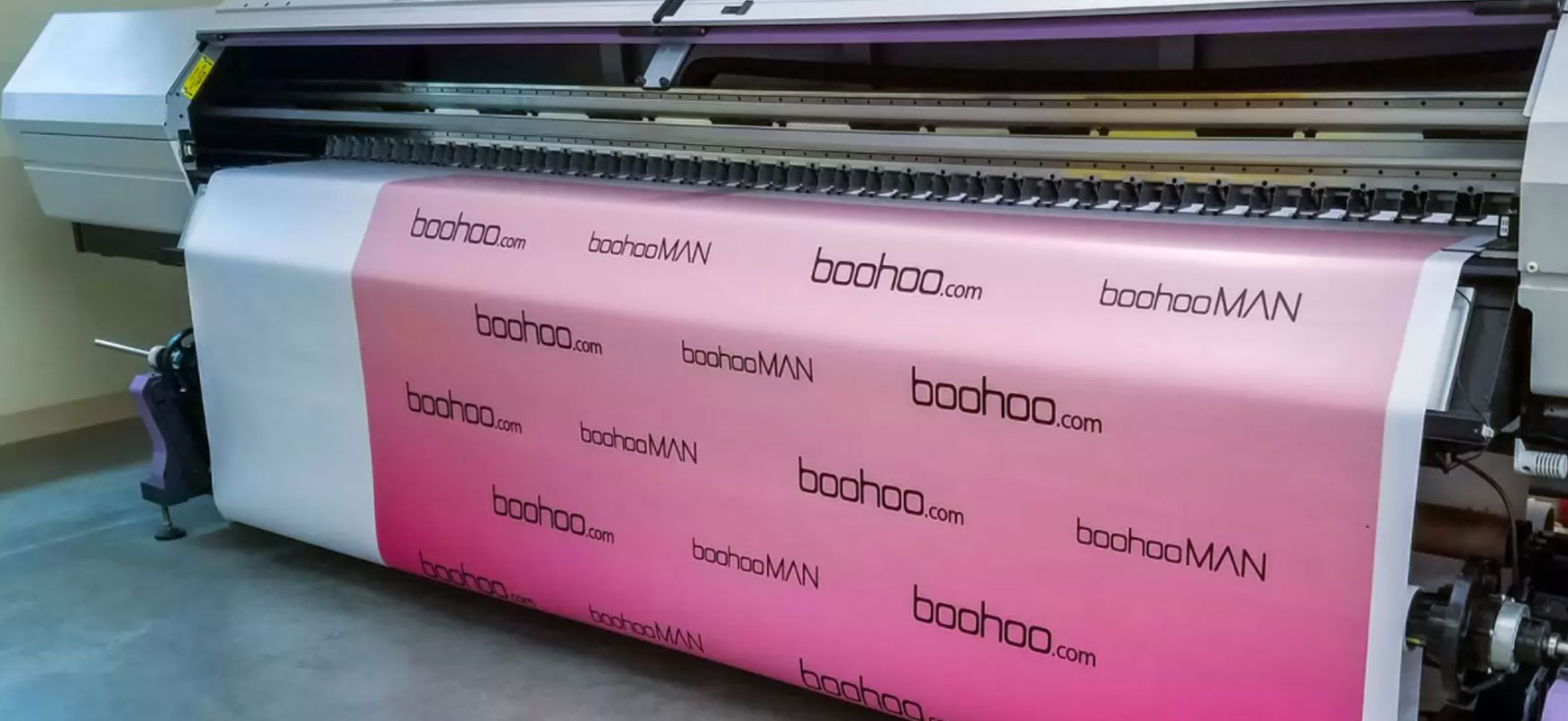 Boohoo trade show banner display in pink made of vinyl