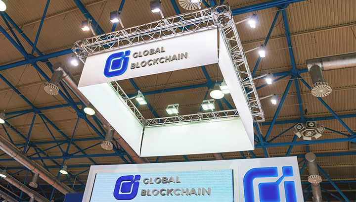 Global Blockchain trade show booth displaying the brand name and logo for branding
