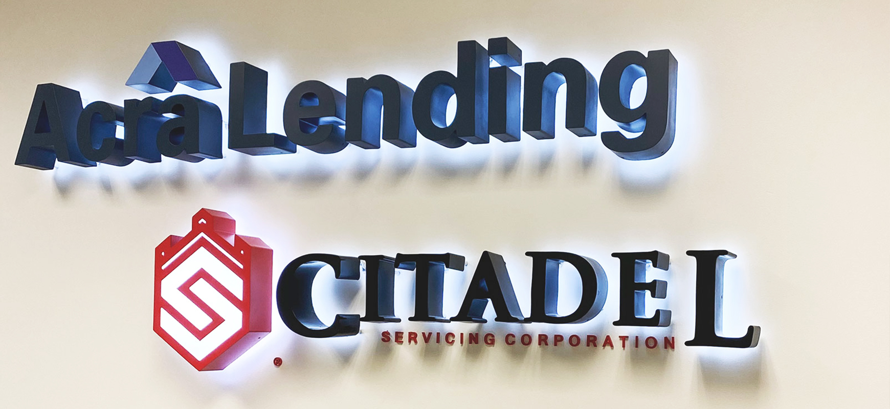 Acra Lending reverse channel letters made of aluminum for office branding