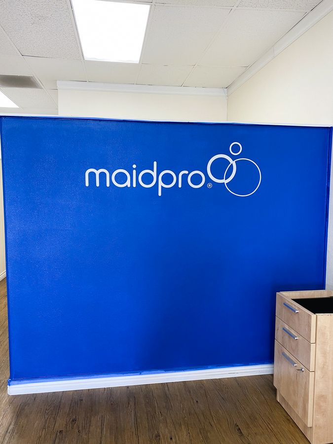 Maidpro custom interior wall sign displaying the company name and logo made of opaque vinyl