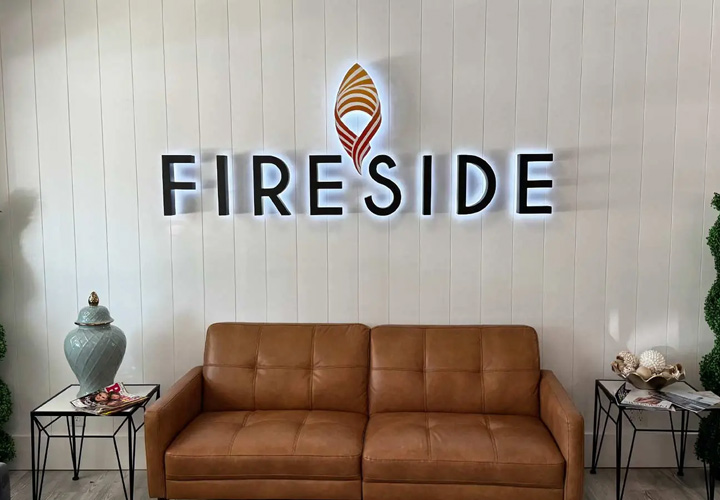 Reverse channel letters with logo for Fireside in reception area, made of aluminum and lexan