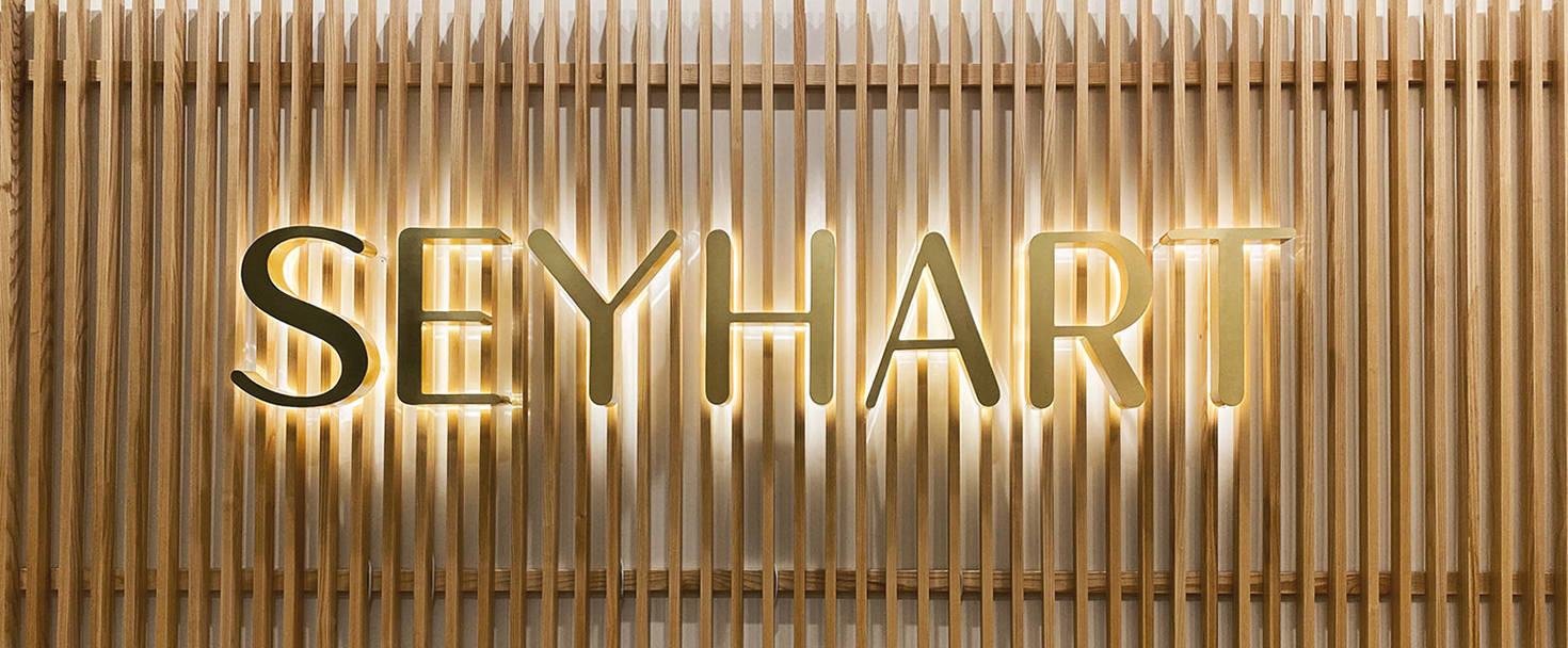 Seyhart reverse channel letters in golden color made of aluminum and acrylic