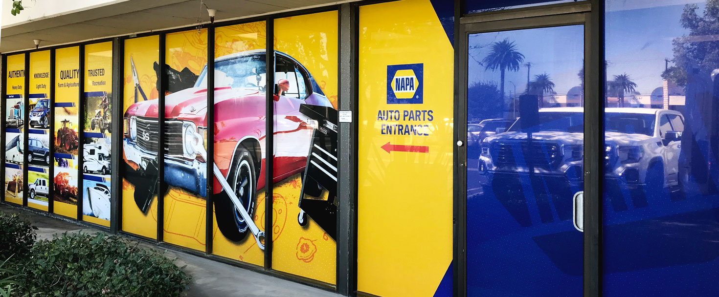 Napa Auto Parts storefront window sign with branded graphics made of perforated vinyl