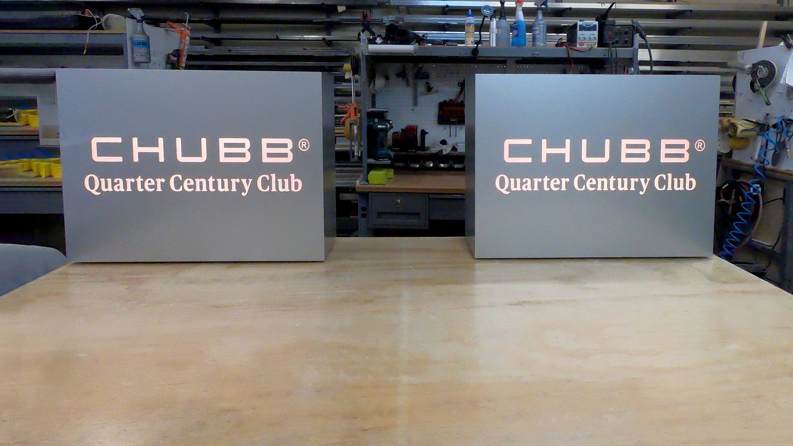 Chubb Quarter Century Club large light boxes with the brand name made of aluminum and acrylic