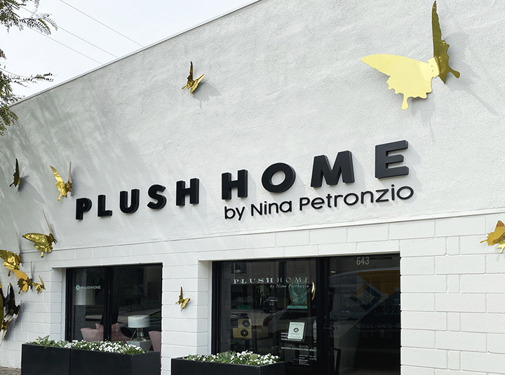 Plush Home full store branding with letters and decorative butterflies made of aluminum