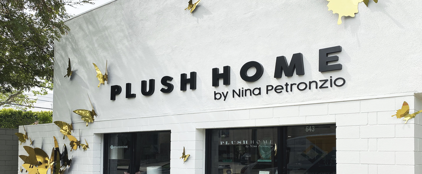 Plush Home custom storefront sign with decorative butterflies made of aluminum