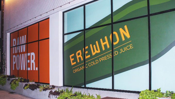 Erewhon store window graphics displaying the brand name and values made of opaque vinyl