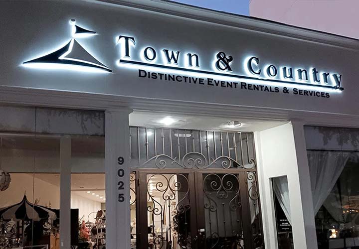 Town & Country storefront sign with back illumination made of acrylic and aluminum for branding