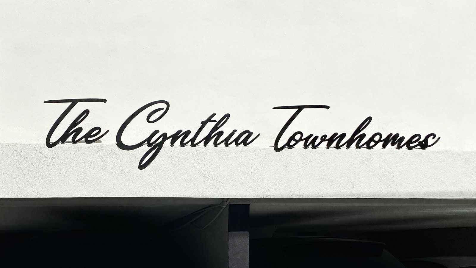 The Cynthia Townhomes 3d sign letters with an elegant font painted in black made of aluminum