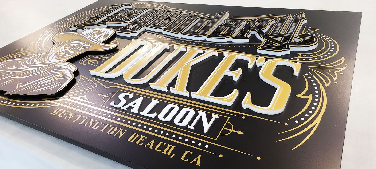 Duke's saloon push through sign