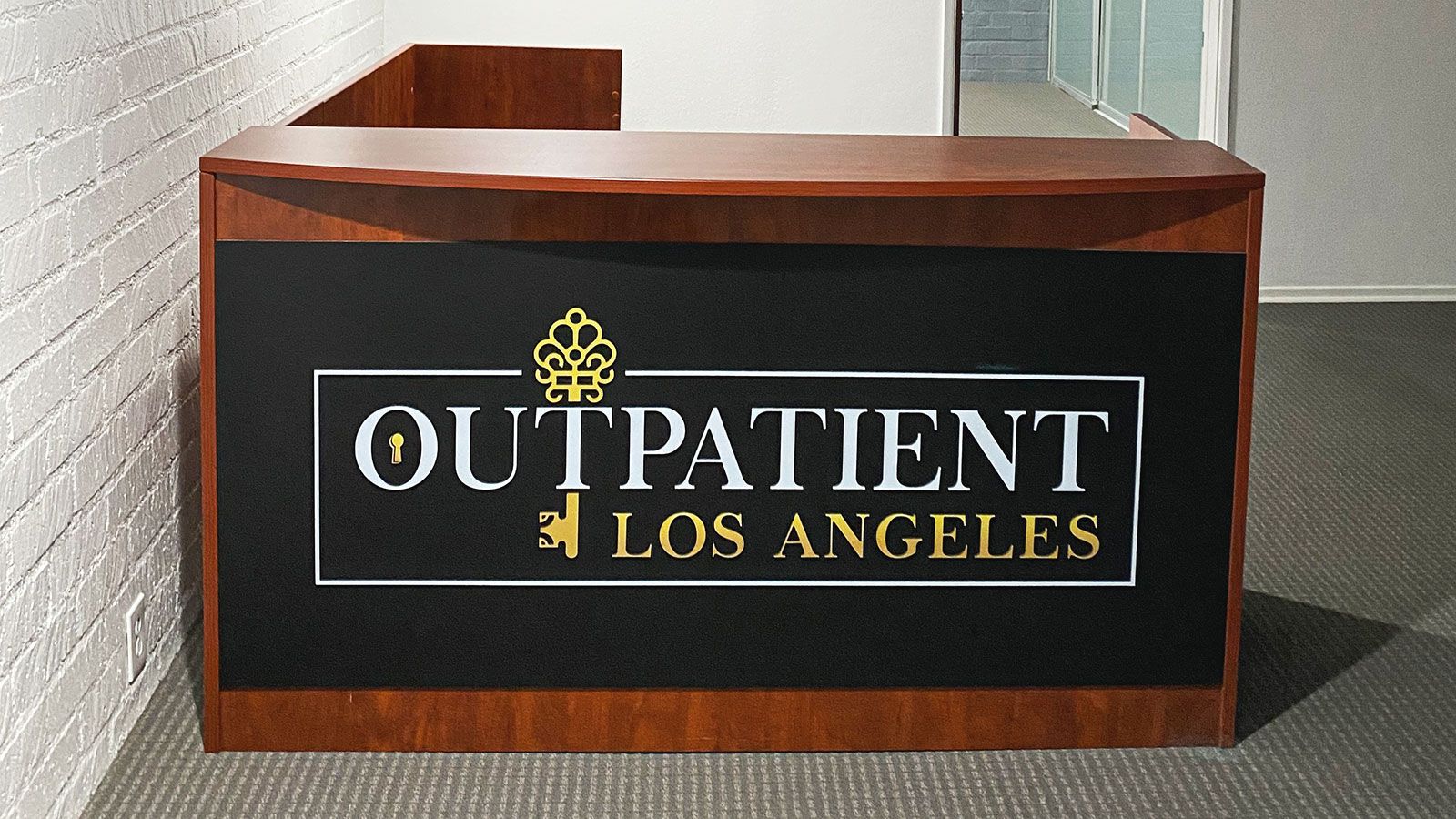 Outpatient Los Angeles reception desk logo sign made of PVC for interior branding