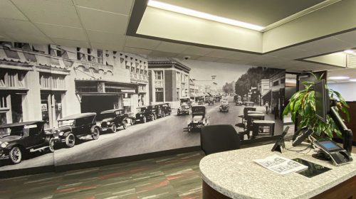 custom interior wall sign with retro images of a city made of opaque vinyl for office branding