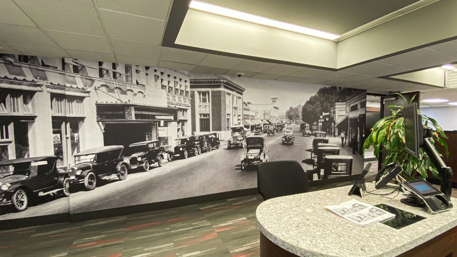 custom interior wall sign with retro images of a city made of opaque vinyl for office branding