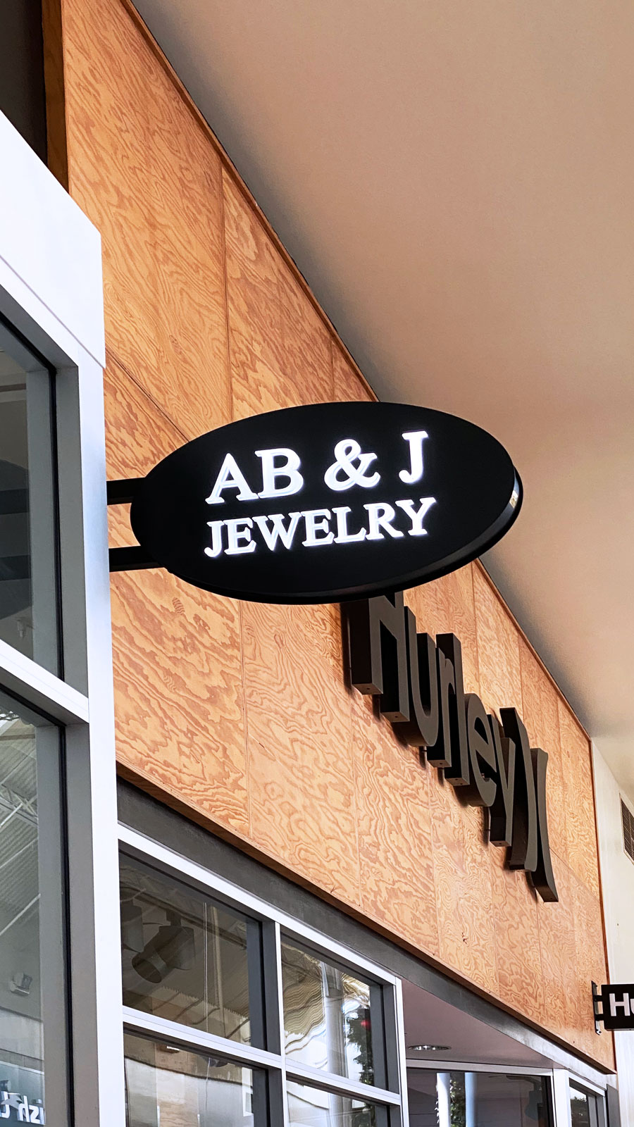 AB & J Jewelry light box sign in an oval shape made of aluminum and acrylic for branding