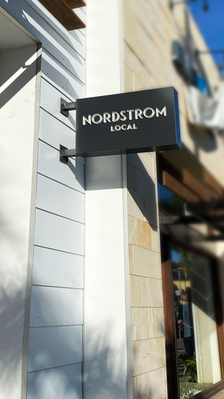 Nordstrom Local exterior light box in black color and wall-blade made of aluminum and acrylic