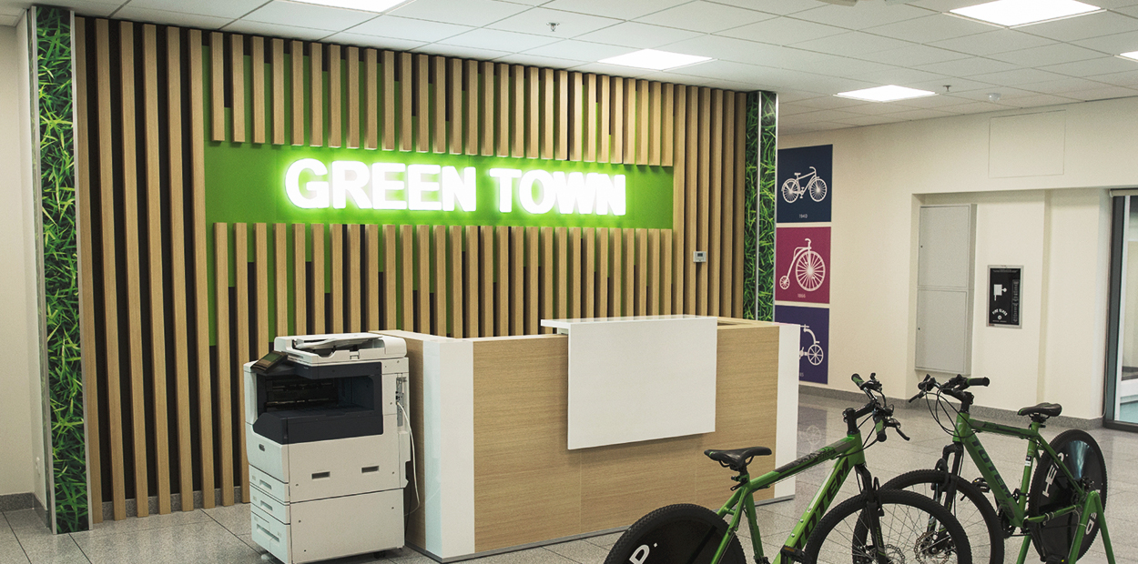 Green Town sustainable brand campaign with natural wall graphics