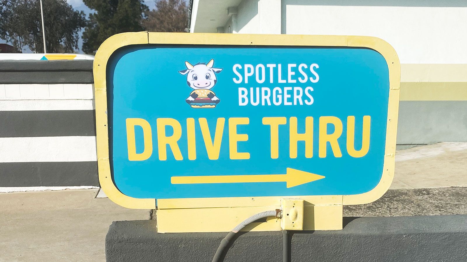 Spotless burgers directional sign