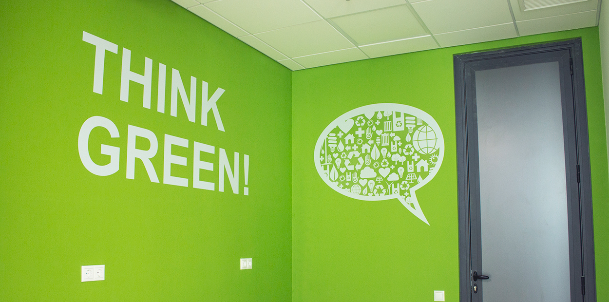 Think Green eco friendly campaign shown on the wall